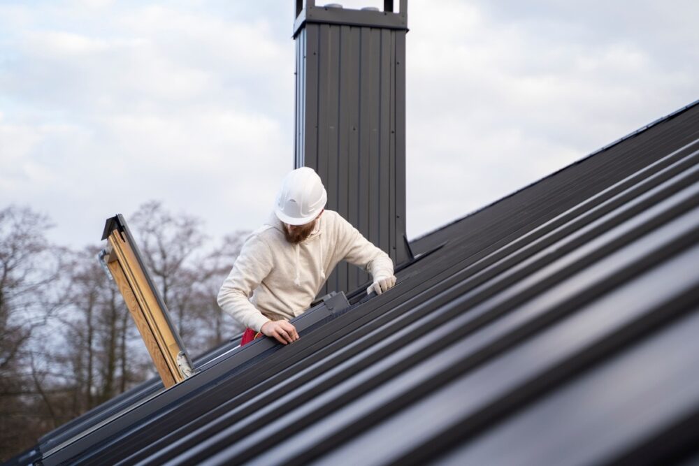 Man cleaning the roof.